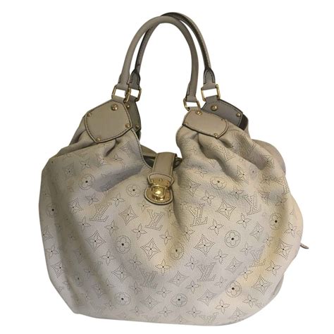 louis vuitton cream bag|Louis Vuitton mahina bag.